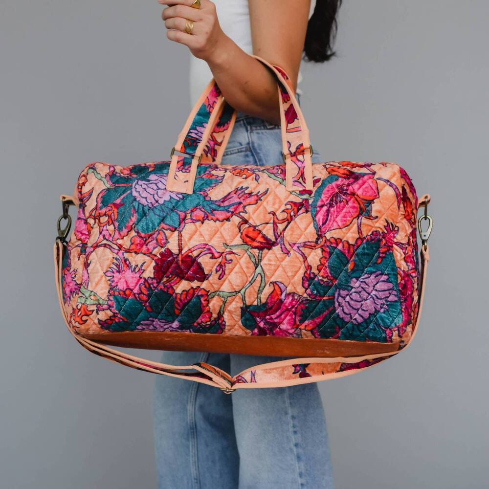 NEW PANACHE APPAREL women's velvet floral duffel bag in light orange and multico